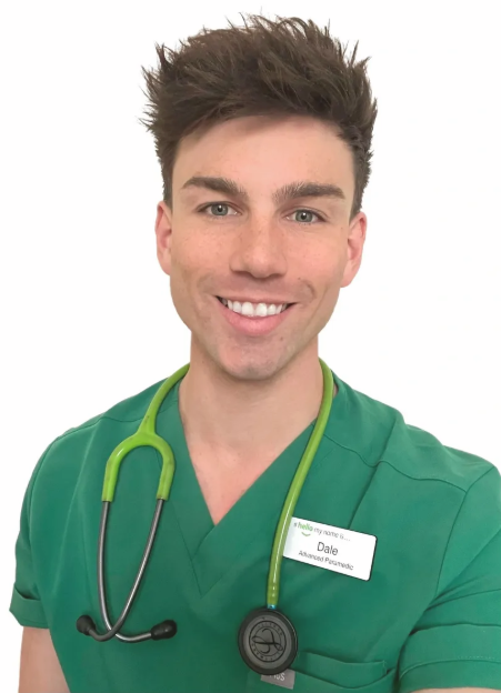 Dale Renno in green scrubs with a stethoscope